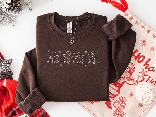 Brown sweatshirt with gingerbread man design on a festive background